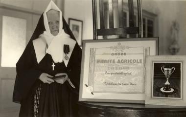 Sister Sainte-Louise-Marie (Marie-Apolline McKenzie) wearing the Commandeur du mérite agricole medal