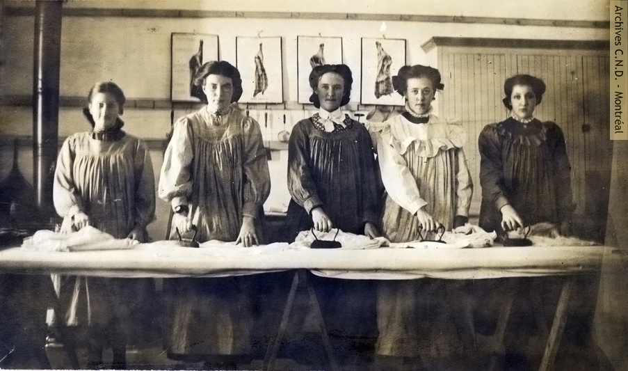 Students practicing ironing at École normale classico-ménagère